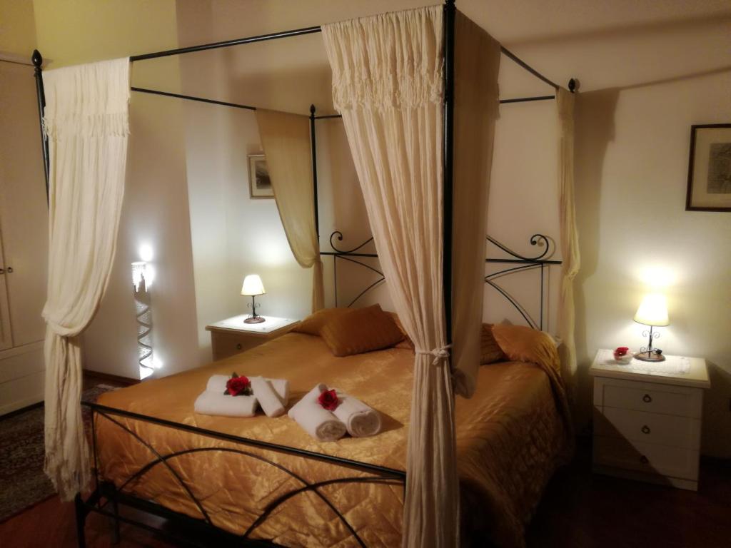 Posteľ alebo postele v izbe v ubytovaní Ai Tre Portoni