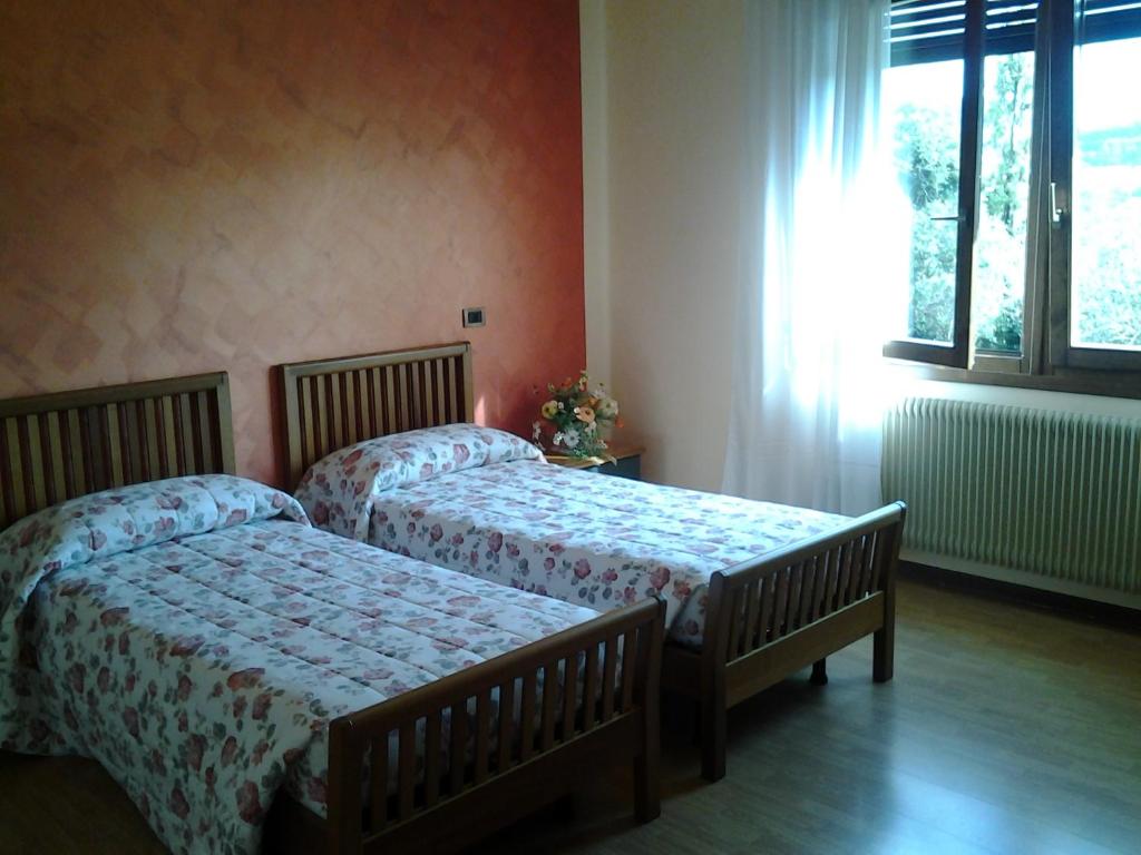 Postel nebo postele na pokoji v ubytování B&B La Palanca