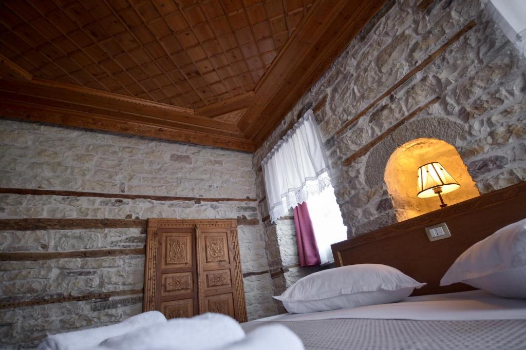 Postel nebo postele na pokoji v ubytování Hotel Kalemi 2