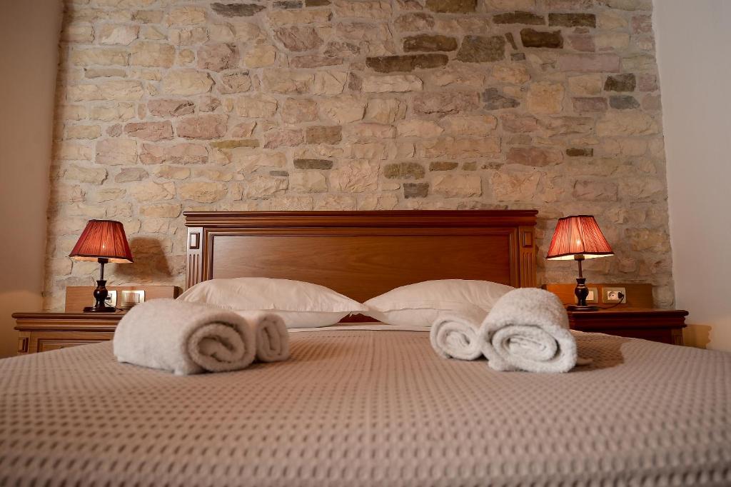 Postel nebo postele na pokoji v ubytování Hotel Kalemi 2
