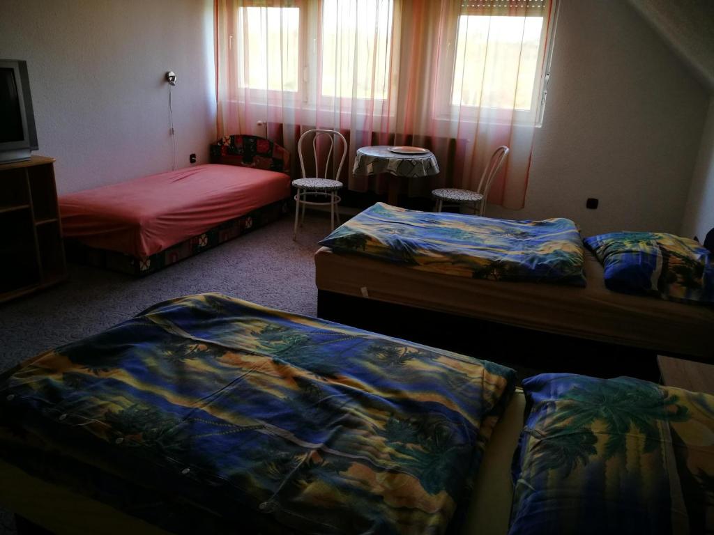 Postel nebo postele na pokoji v ubytování Páterdombi Vendégház