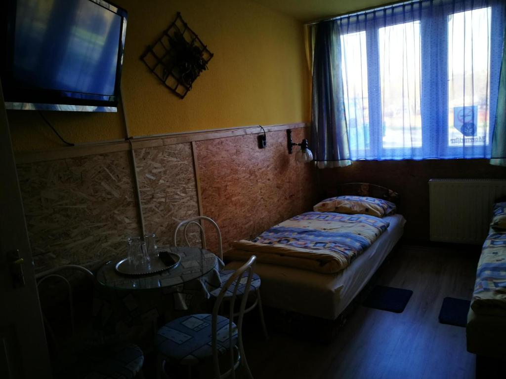 Postel nebo postele na pokoji v ubytování Páterdombi Vendégház