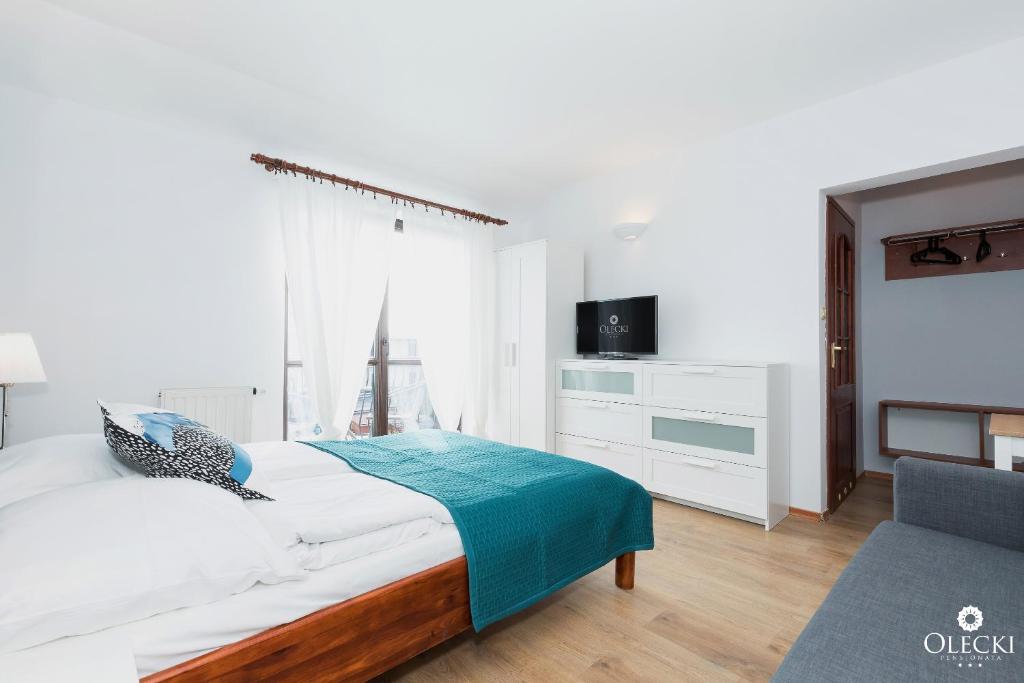Posteľ alebo postele v izbe v ubytovaní OLECKI Holiday House