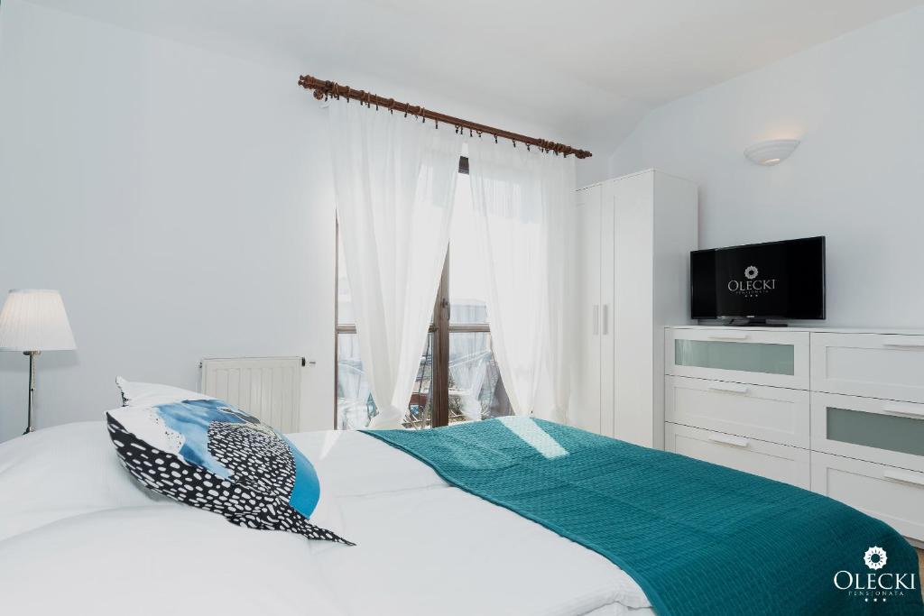 Posteľ alebo postele v izbe v ubytovaní OLECKI Holiday House