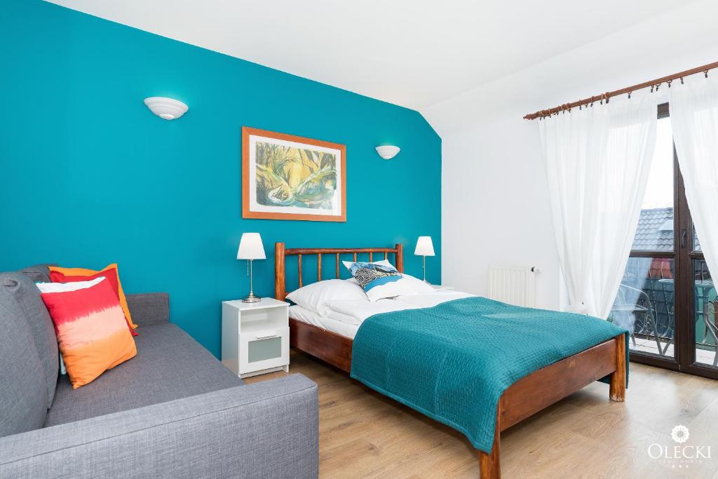 Posteľ alebo postele v izbe v ubytovaní OLECKI Holiday House