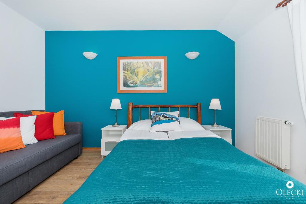 Posteľ alebo postele v izbe v ubytovaní OLECKI Holiday House