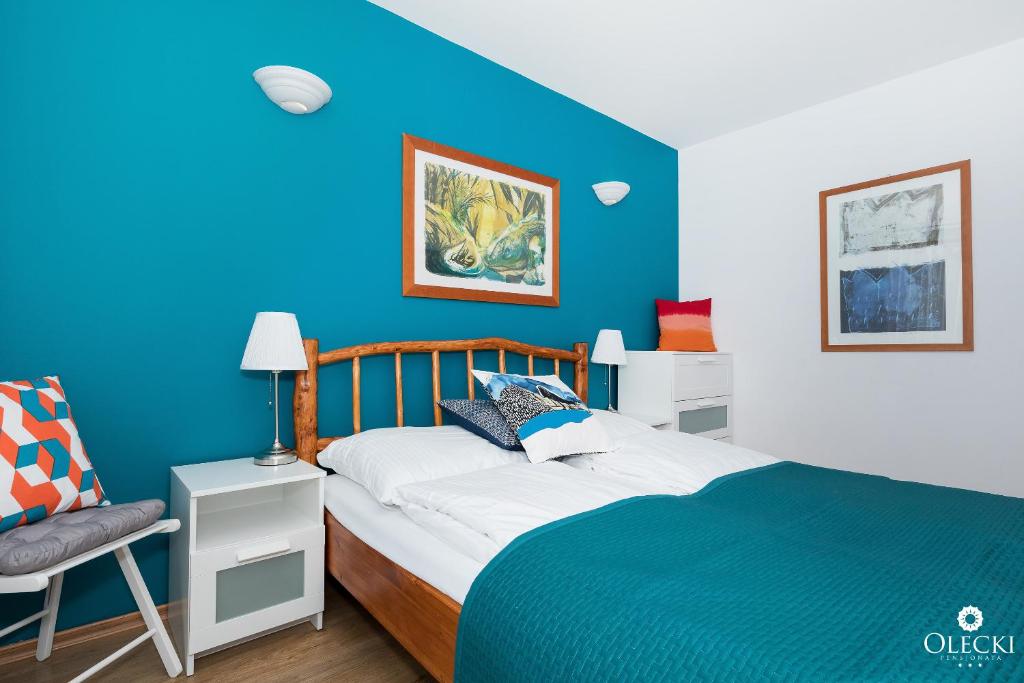 Posteľ alebo postele v izbe v ubytovaní OLECKI Holiday House