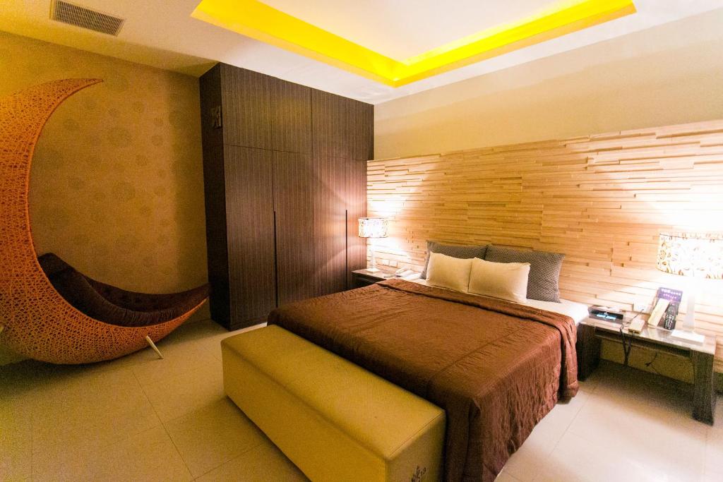 Postel nebo postele na pokoji v ubytování Zhen 13 Villa Motel