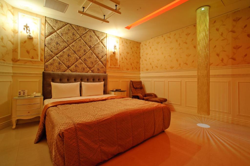 Postel nebo postele na pokoji v ubytování Zhen 13 Villa Motel