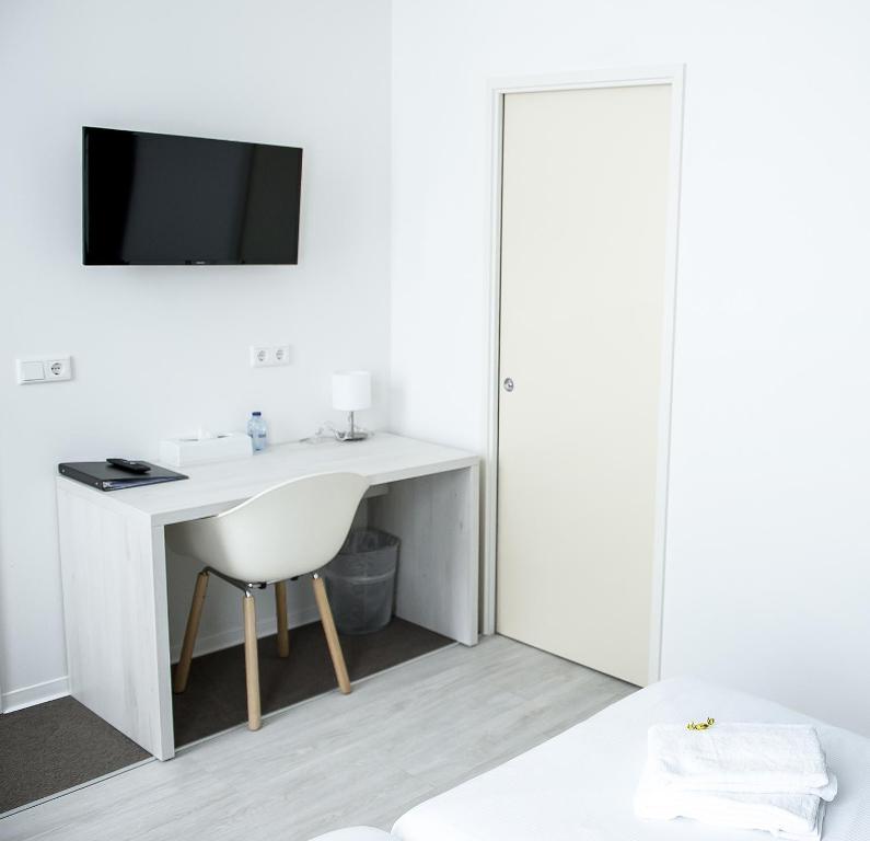 TV a/nebo společenská místnost v ubytování City2Beach Hotel