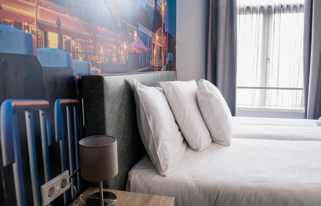 Postel nebo postele na pokoji v ubytování City2Beach Hotel