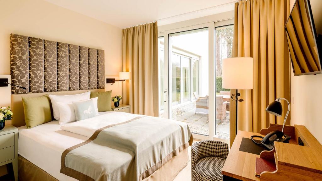 Postel nebo postele na pokoji v ubytování Parkhotel Rothof