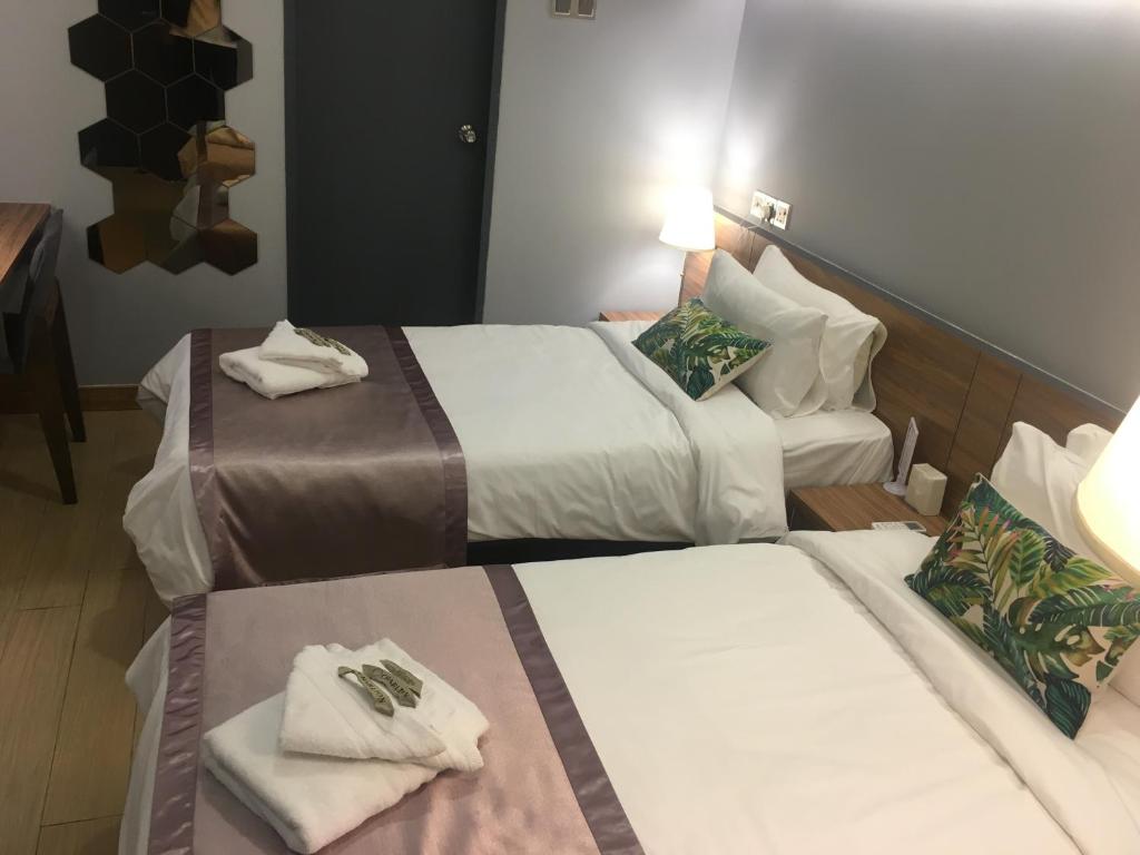 Postel nebo postele na pokoji v ubytování Hotel Gaia 95