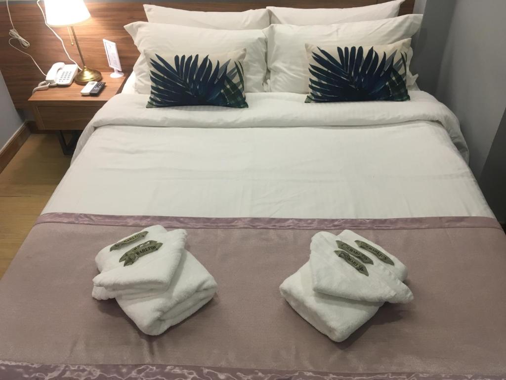 Postel nebo postele na pokoji v ubytování Hotel Gaia 95