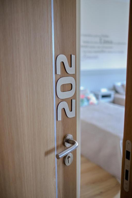 Postel nebo postele na pokoji v ubytování Hotel Os Poetas