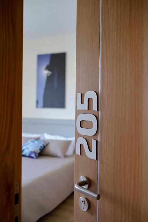 Postel nebo postele na pokoji v ubytování Hotel Os Poetas