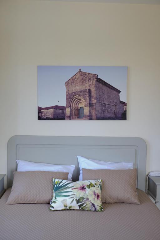 Postel nebo postele na pokoji v ubytování Hotel Os Poetas