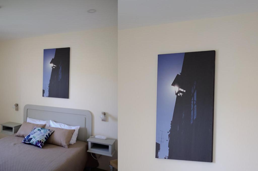 Postel nebo postele na pokoji v ubytování Hotel Os Poetas