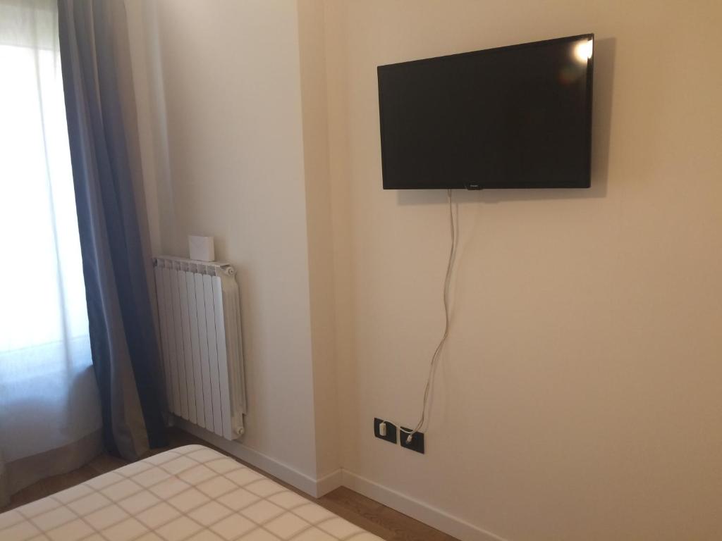 TV a/nebo společenská místnost v ubytování Palazzo Fratini