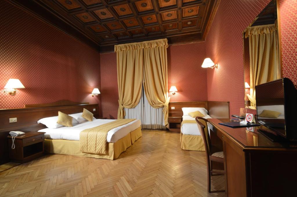 Postel nebo postele na pokoji v ubytování Hotel Montecarlo