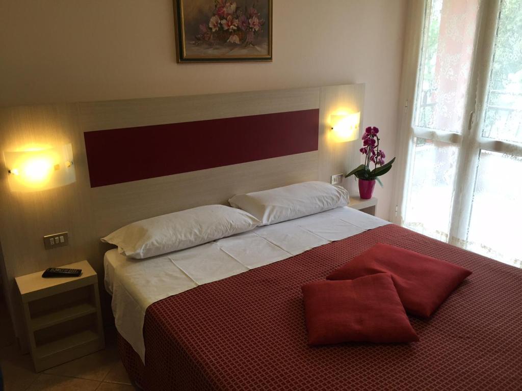 Postel nebo postele na pokoji v ubytování Albergo Riva