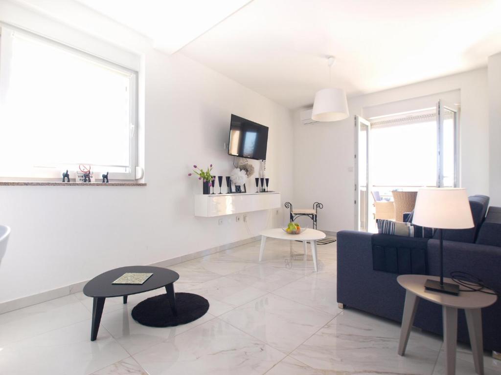Televízia a/alebo spoločenská miestnosť v ubytovaní Apartment Durdica 1587