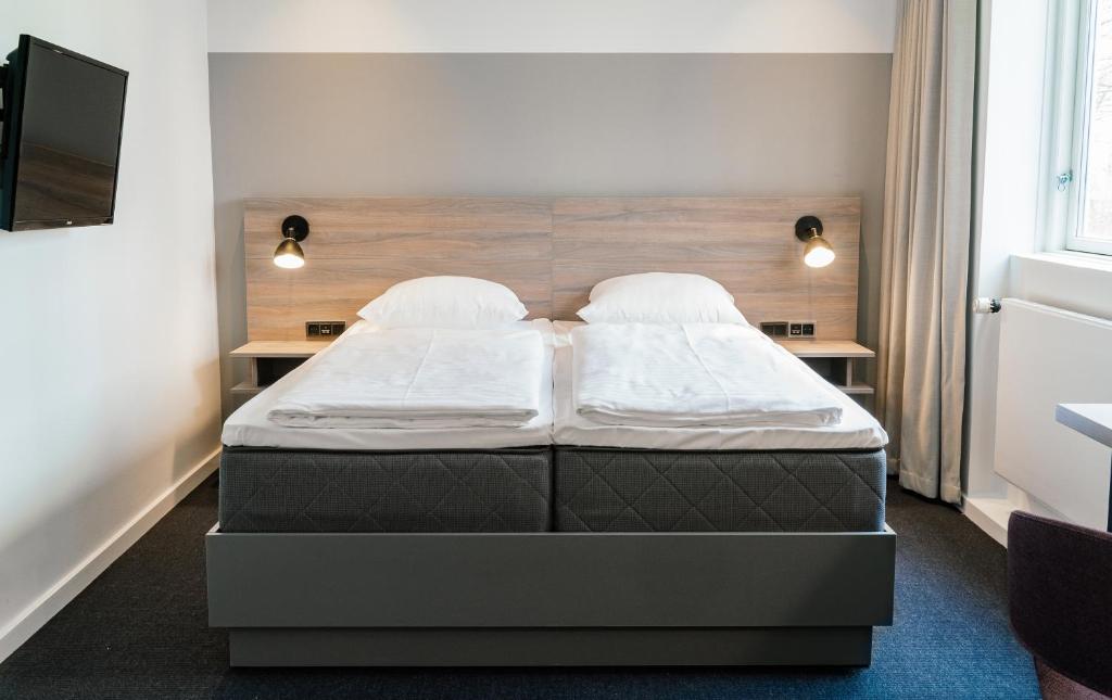 Postel nebo postele na pokoji v ubytování Copenhagen Go Hotel
