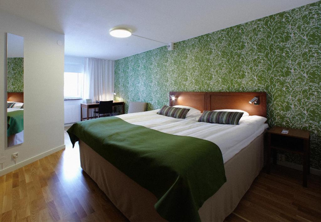 Postel nebo postele na pokoji v ubytování Hotell Conrad