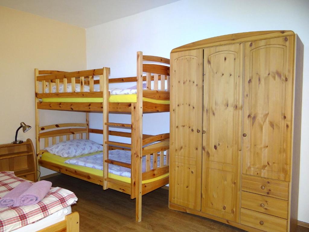 Una cama o camas en una habitación de Farma Růžová