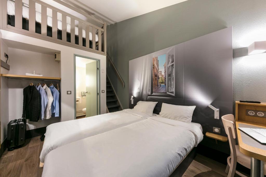 Postel nebo postele na pokoji v ubytování B&B HOTEL Toulouse Cité de l'Espace Mouchotte
