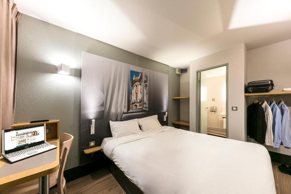 Krevet ili kreveti u jedinici u okviru objekta B&B HOTEL Toulouse Cité de l'Espace Mouchotte