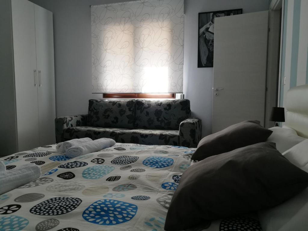 A bed or beds in a room at B&B A casa dell'artista