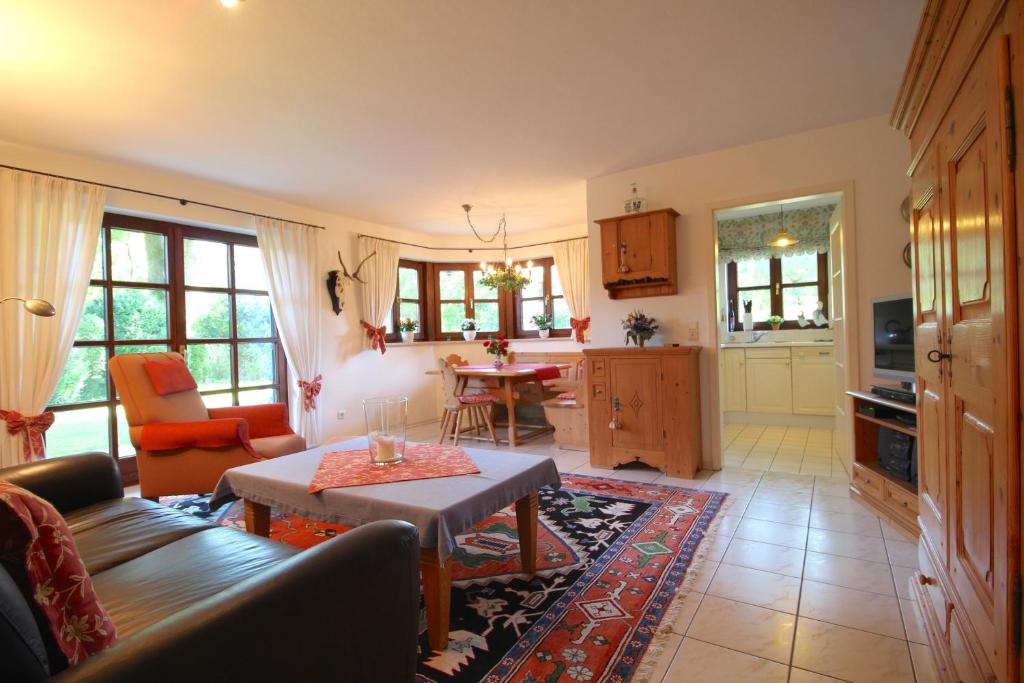 a living room with a couch and a table at FeWo Gudrun in Garmisch-Partenkirchen