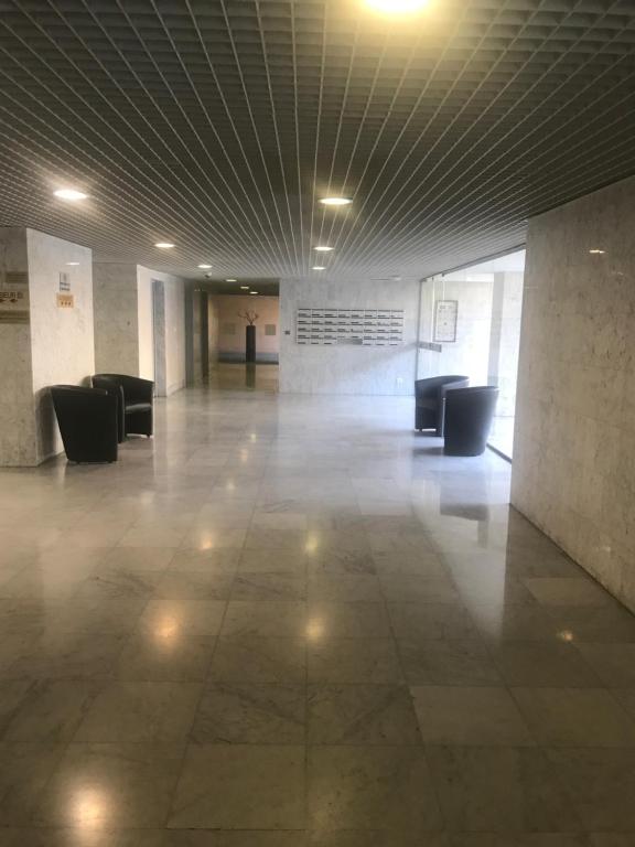 an empty lobby with couches in a building at Monaco Studio "907" in Monte Carlo
