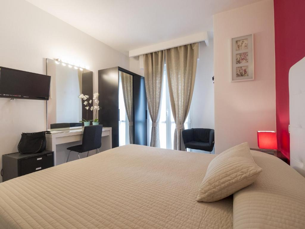 Postel nebo postele na pokoji v ubytování Hotel Levante