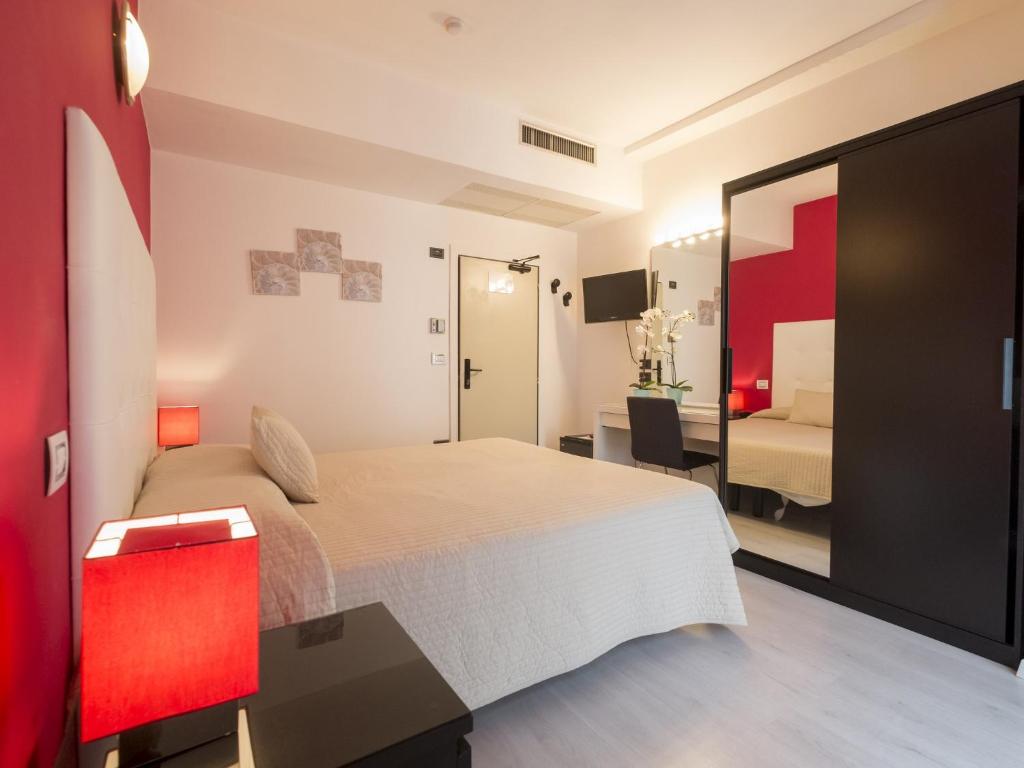 Postel nebo postele na pokoji v ubytování Hotel Levante