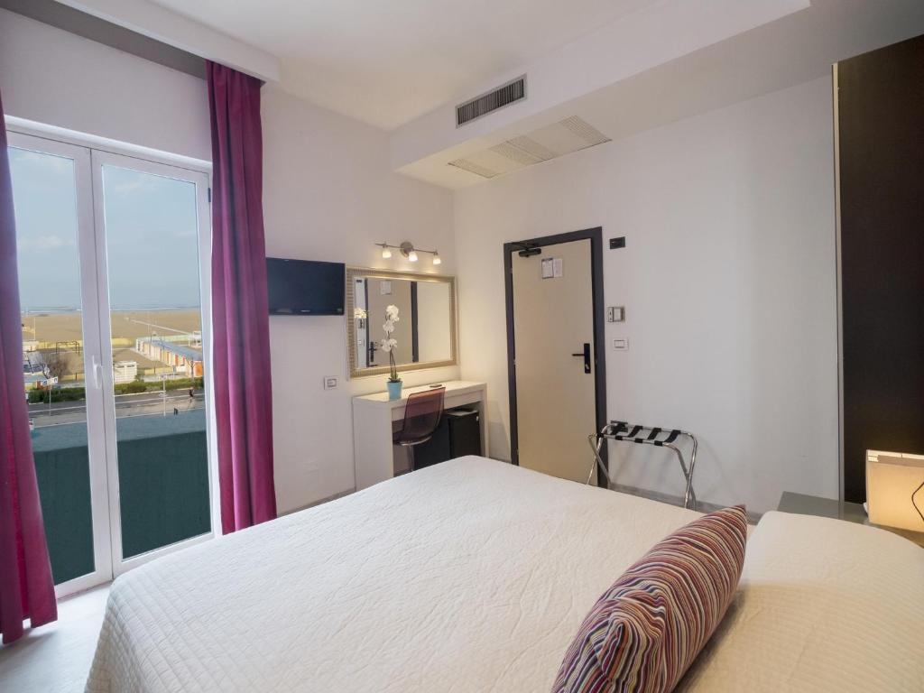 Postel nebo postele na pokoji v ubytování Hotel Levante