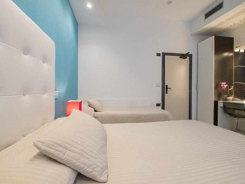Postel nebo postele na pokoji v ubytování Hotel Levante