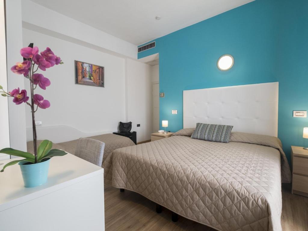 Postel nebo postele na pokoji v ubytování Hotel Levante