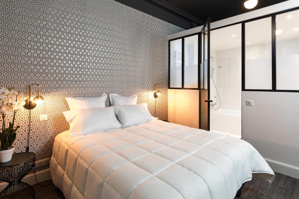 Postel nebo postele na pokoji v ubytování Arome Hotel