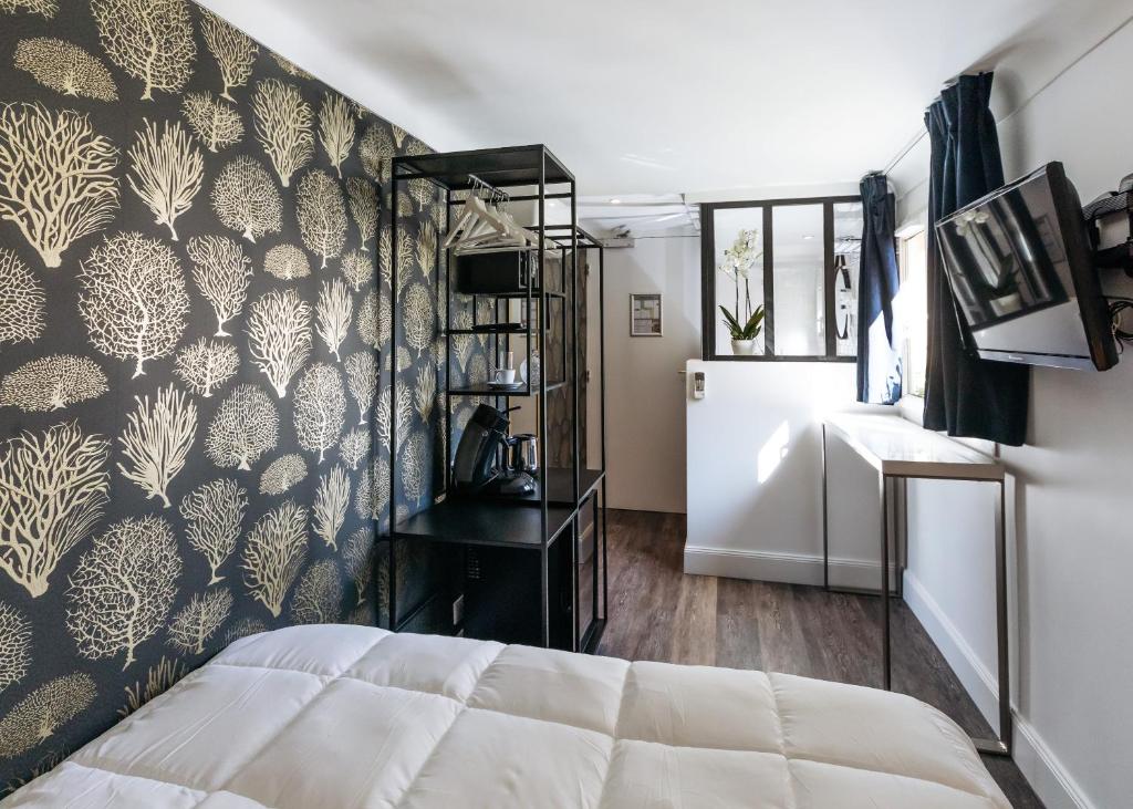 TV a/nebo společenská místnost v ubytování Arome Hotel