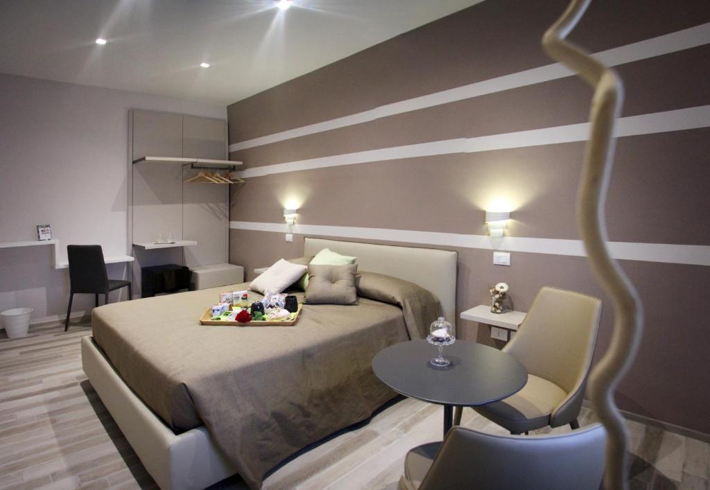 Postel nebo postele na pokoji v ubytování Relais Marlene