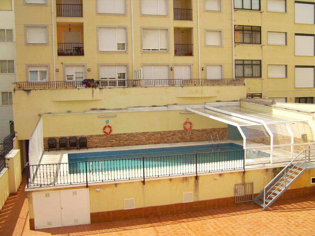 Bazén v ubytovaní Tres dormitorios con magníficas vistas al mar alebo v jeho blízkosti