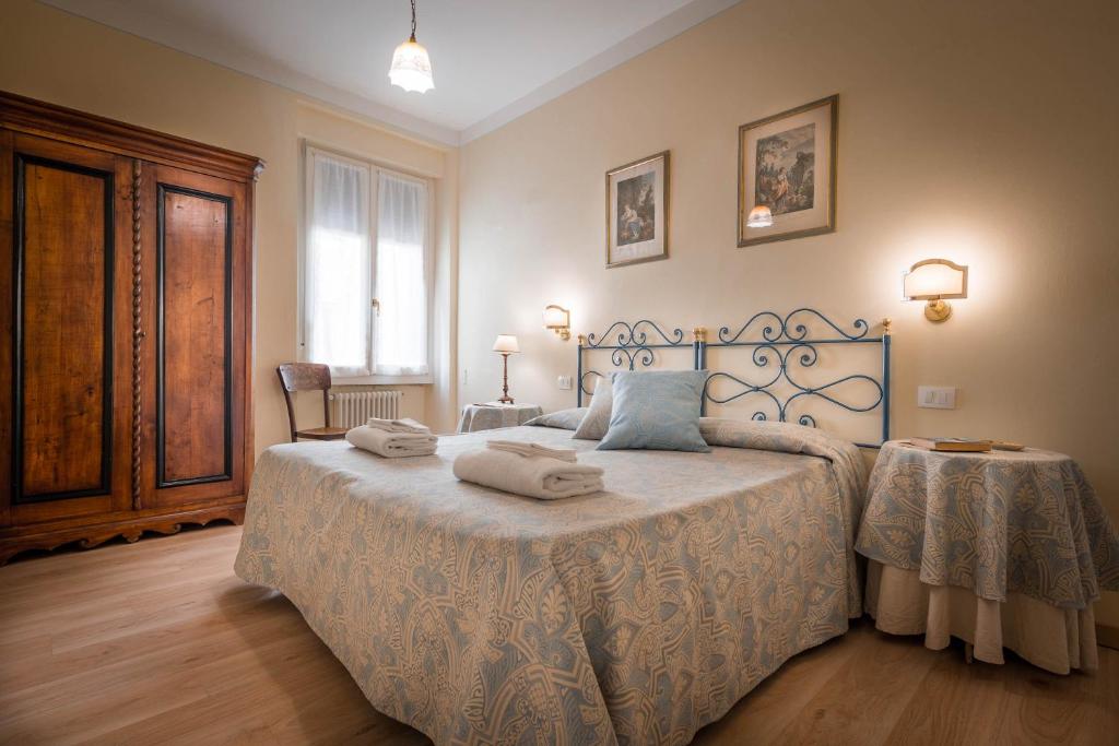 Posteľ alebo postele v izbe v ubytovaní Santa Felicita Apartments