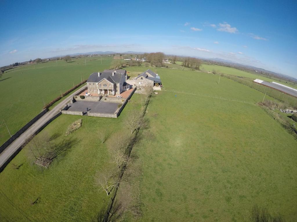 an aerial view of a large house in a field at Tomedjocon in Fermoy
