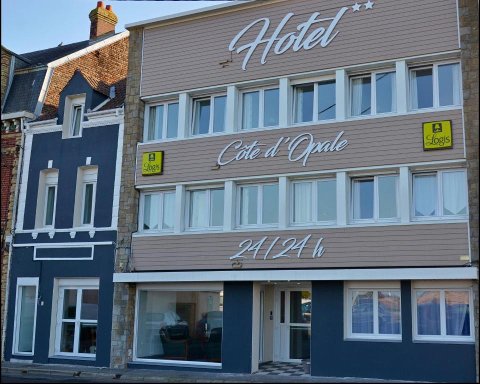 a building with a sign for a club at opale at Hotel Côte d'Opale in Étaples