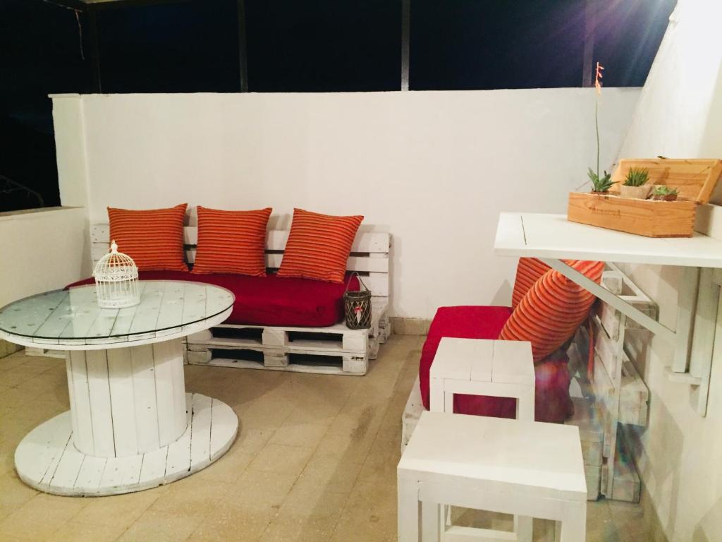 a living room with a couch and a table at Appartamento La Terrazza in Castellammare del Golfo