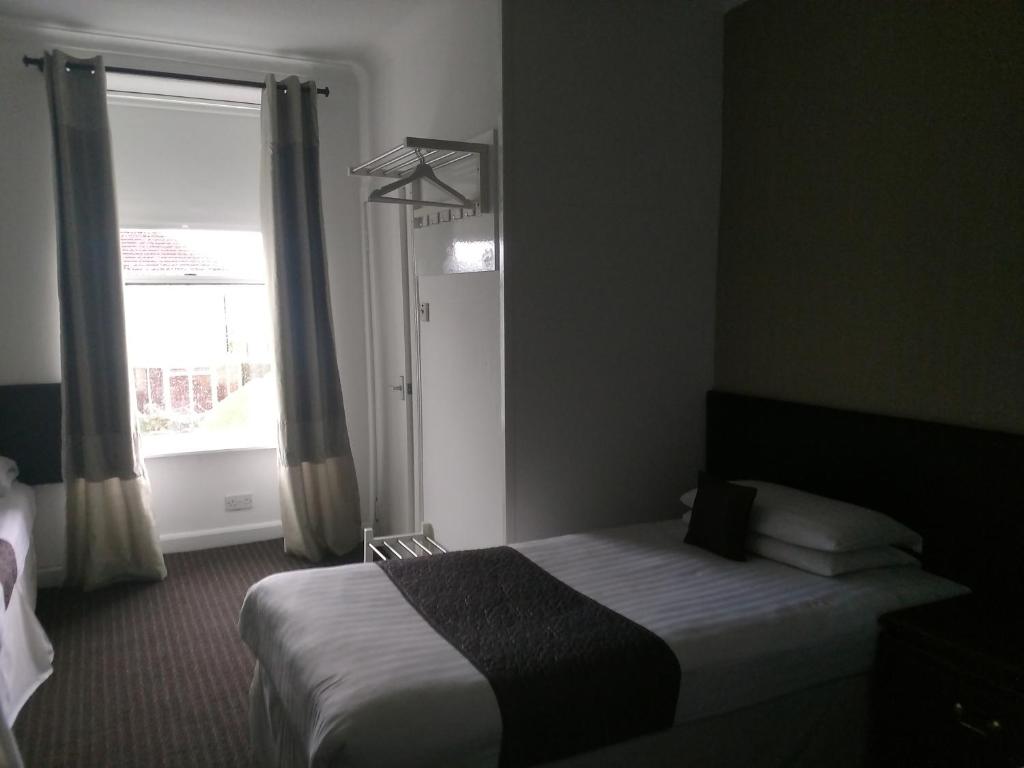 Postel nebo postele na pokoji v ubytování The Park Hotel