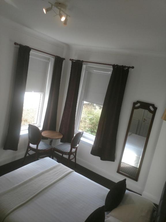 Postel nebo postele na pokoji v ubytování The Park Hotel