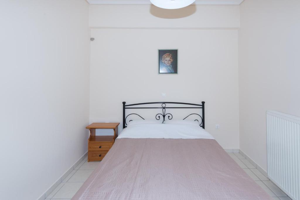 Posteľ alebo postele v izbe v ubytovaní Vithos Apartment